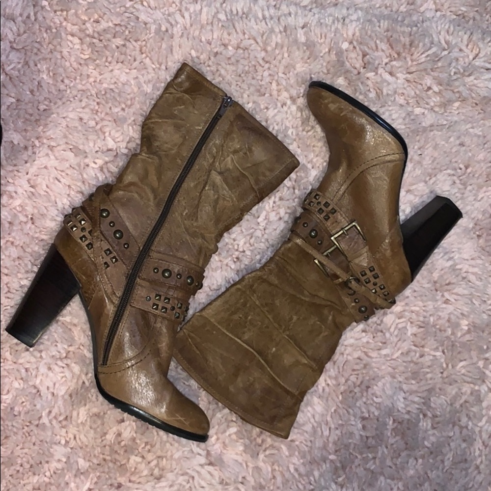 Distressed brown boots with studs
